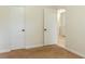 Bedroom showcasing neutral carpet and access to the en-suite bathroom and closet at 409 E Gulley Ave, Oakland, FL 34760