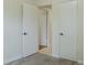 Bedroom with carpet flooring, access to other rooms, and closet space at 409 E Gulley Ave, Oakland, FL 34760