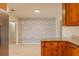 Bright dining room with wood-look accent wall, neutral paint, and tile flooring at 409 E Gulley Ave, Oakland, FL 34760