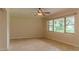 Bright living room featuring tile floors and an oversized window at 409 E Gulley Ave, Oakland, FL 34760