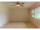 Inviting living room with natural light, tile floors, and neutral color scheme at 409 E Gulley Ave, Oakland, FL 34760