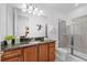 Bathroom showing a single sink vanity, granite countertops, and stand-up shower at 441 Novi Path, Kissimmee, FL 34747