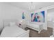 Bright bedroom with white twin beds, chandelier, and Frozen-themed decor at 441 Novi Path, Kissimmee, FL 34747