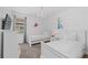 Bright bedroom with white twin beds, chandelier, and Frozen-themed decor at 441 Novi Path, Kissimmee, FL 34747
