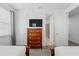 Bedroom showcasing two beds, a dresser, and an en-suite bathroom at 441 Novi Path, Kissimmee, FL 34747
