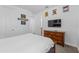 Bedroom featuring a bed, dresser, and Marvel-themed decor at 441 Novi Path, Kissimmee, FL 34747