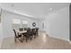 Inviting dining area with a large table set for six, modern tile flooring, and tastefully decorated at 441 Novi Path, Kissimmee, FL 34747