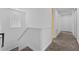 Bright upstairs hallway with carpet and white trim at 441 Novi Path, Kissimmee, FL 34747