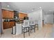Kitchen featuring granite countertops, stainless steel appliances, and a breakfast bar with seating at 441 Novi Path, Kissimmee, FL 34747