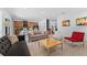 Bright living room showcasing an open floor plan with modern furniture and tile flooring at 441 Novi Path, Kissimmee, FL 34747