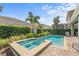 Backyard oasis with a private pool, spa, and mature landscaping providing a serene retreat at 441 Novi Path, Kissimmee, FL 34747