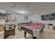 Spacious basement with a pool table and game area at 446 Summer Place Loop, Clermont, FL 34714