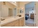 Bathroom with a single sink vanity and an attached bedroom at 446 Summer Place Loop, Clermont, FL 34714