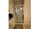 Bathroom features a glass shower, tiled floors, and neutral color scheme at 446 Summer Place Loop, Clermont, FL 34714