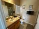 Well-lit bathroom features a neutral color scheme, vanity, and a shower at 446 Summer Place Loop, Clermont, FL 34714