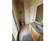 Bright bathroom featuring a white vanity, toilet, and neutral tile flooring at 446 Summer Place Loop, Clermont, FL 34714