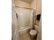 Clean bathroom featuring white tiled shower/tub and Mickey themed decor at 446 Summer Place Loop, Clermont, FL 34714