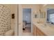 Bathroom with a Mickey Mouse themed shower curtain, single sink and views to a bedroom at 446 Summer Place Loop, Clermont, FL 34714