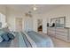 Comfortable bedroom with ample storage, and a view into the bathroom at 446 Summer Place Loop, Clermont, FL 34714