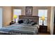 Cozy bedroom with plush bedding, decorative pillows, and soft lighting for ultimate relaxation at 446 Summer Place Loop, Clermont, FL 34714