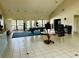 Clubhouse interior with pool table, tables and chairs, and welcome signage at 446 Summer Place Loop, Clermont, FL 34714