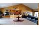 Welcoming clubhouse interior with reception area, seating, and a pool table at 446 Summer Place Loop, Clermont, FL 34714