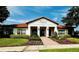 Exterior shot of the High Grove Clubhouse with a red tile roof at 446 Summer Place Loop, Clermont, FL 34714