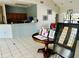 Clubhouse reception area with counter, tables, and community information at 446 Summer Place Loop, Clermont, FL 34714