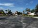 Community entrance with lush landscaping and the 'High Grove' sign on display at 446 Summer Place Loop, Clermont, FL 34714
