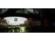 Well-lit community sign 'High Grove' at night, surrounded by manicured landscaping at 446 Summer Place Loop, Clermont, FL 34714