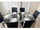 Elegant dining table with seating for six, perfect for hosting dinner parties at 446 Summer Place Loop, Clermont, FL 34714