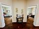 Inviting hallway leading to bedrooms with a decor table between the doorways at 446 Summer Place Loop, Clermont, FL 34714