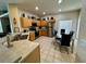 Bright eat-in kitchen with stainless steel appliances and dining table at 446 Summer Place Loop, Clermont, FL 34714