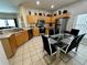 Bright kitchen with stainless steel appliances and dining table at 446 Summer Place Loop, Clermont, FL 34714