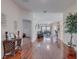 Open-concept living area with hardwood floors and a view of the interior at 446 Summer Place Loop, Clermont, FL 34714