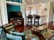 Comfortable sofas and bar counter with stool seating at 446 Summer Place Loop, Clermont, FL 34714