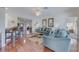 Bright living room with hardwood floors and stylish blue sofas, perfect for Gathering gatherings at 446 Summer Place Loop, Clermont, FL 34714