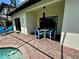Covered patio with outdoor seating and a view of the pool at 446 Summer Place Loop, Clermont, FL 34714