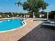 Inviting community pool and spa area featuring comfortable lounge chairs for relaxing outdoors at 446 Summer Place Loop, Clermont, FL 34714