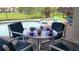 Inviting outdoor dining space with a view of the pool and lush green backyard at 446 Summer Place Loop, Clermont, FL 34714