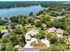 Stunning lakefront property with lush landscaping and a private pool at 4674 Hall Rd, Orlando, FL 32817
