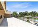 Large balcony overlooking the backyard pool and lush landscaping, perfect for outdoor relaxation and enjoyment at 4674 Hall Rd, Orlando, FL 32817