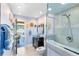 Cozy bathroom with a glass-enclosed shower, vanity, and access to a private outdoor patio at 4674 Hall Rd, Orlando, FL 32817