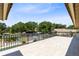 Expansive outdoor deck with black metal railings overlooks the backyard and canal, perfect for entertaining and relaxation at 4674 Hall Rd, Orlando, FL 32817