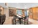 A dining room with a large table, seating for eight, and a wine rack at 4674 Hall Rd, Orlando, FL 32817