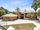 Stunning two-story home featuring a grand entrance and a matching detached two-car garage at 4674 Hall Rd, Orlando, FL 32817