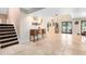 Inviting foyer with travertine floors and a staircase leading to the second floor at 4674 Hall Rd, Orlando, FL 32817