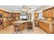 Gourmet kitchen featuring custom cabinets, a center island, and stainless steel appliances at 4674 Hall Rd, Orlando, FL 32817