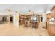 Spacious kitchen featuring an island with seating, custom cabinets, and stainless steel appliances at 4674 Hall Rd, Orlando, FL 32817