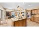 A spacious kitchen with an island cooktop and stainless steel appliances at 4674 Hall Rd, Orlando, FL 32817